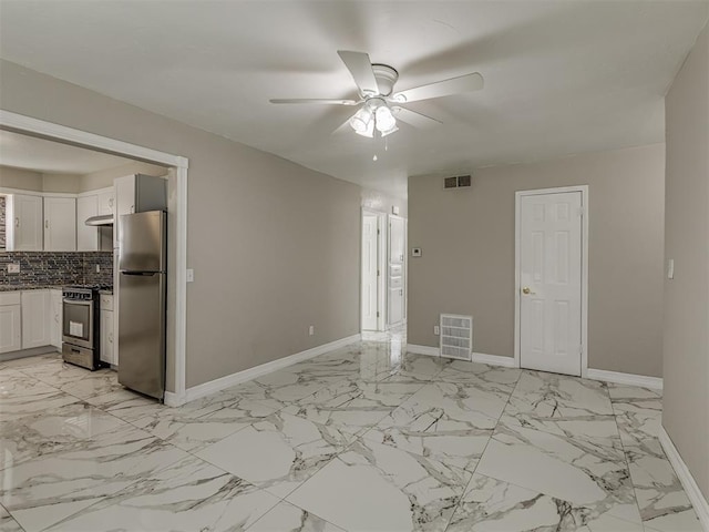 2837 SW 63rd St, Oklahoma City, OK 73159 - spare room with ceiling fan and light marble finish flooring
