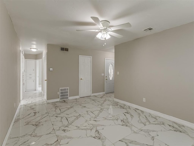 2837 SW 63rd St, Oklahoma City, OK 73159 - unfurnished room featuring light marble finish flooring and ceiling fan