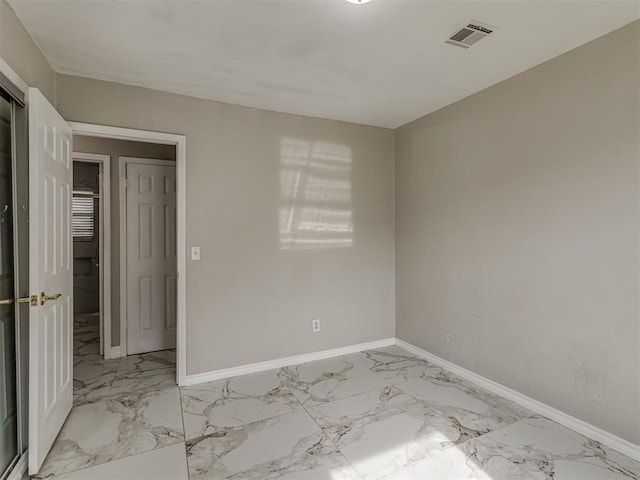 2837 SW 63rd St, Oklahoma City, OK 73159 - spare room featuring light marble finish flooring