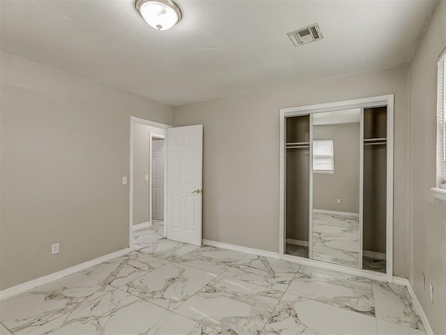 2837 SW 63rd St, Oklahoma City, OK 73159 - unfurnished bedroom featuring marble finish flooring and a closet