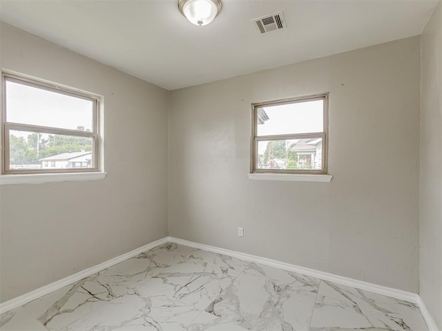 2837 SW 63rd St, Oklahoma City, OK 73159 - spare room with light marble finish flooring and baseboards