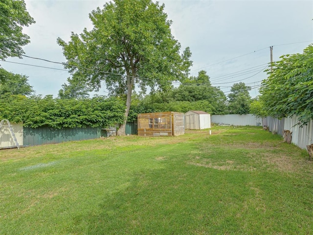 2837 SW 63rd St, Oklahoma City, OK 73159 - fenced backyard featuring a storage unit