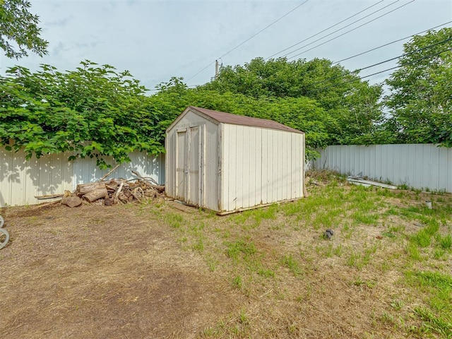 2837 SW 63rd St, Oklahoma City, OK 73159 - fenced backyard with a storage unit