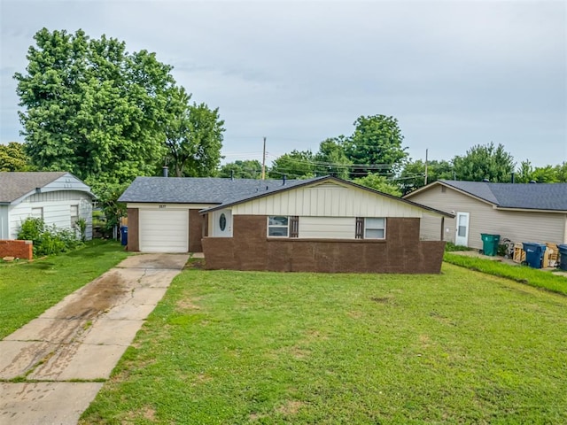 2837 SW 63rd St, Oklahoma City, OK 73159 - ranch-style house featuring concrete driveway, a front lawn, board and batten siding, a garage, and brick siding