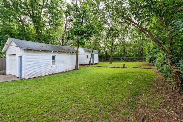 1828 NW 40th St, Oklahoma City, OK 73118 - view of yard featuring an outdoor structure and a detached garage