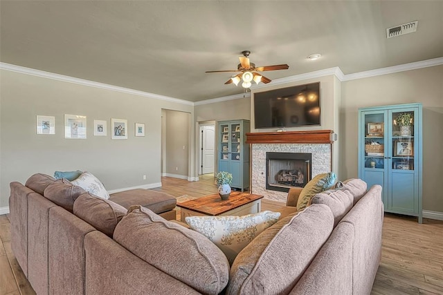 1101 Northridge Blvd, Altus, OK 73521 - living area featuring ornamental molding, a ceiling fan, wood finished floors, and a fireplace