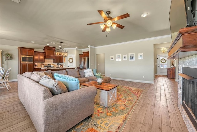 1101 Northridge Blvd, Altus, OK 73521 - living area featuring a ceiling fan, recessed lighting, light wood-type flooring, and ornamental molding