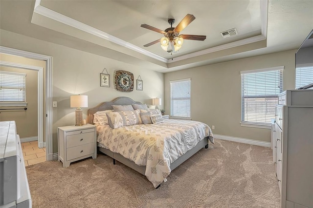 1101 Northridge Blvd, Altus, OK 73521 - bedroom with a tray ceiling, ornamental molding, light colored carpet, and a ceiling fan
