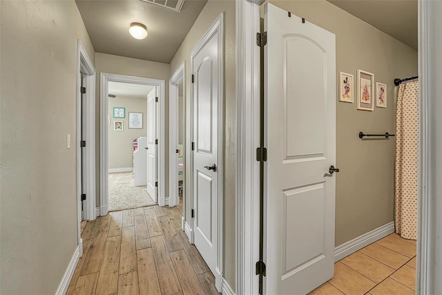 1101 Northridge Blvd, Altus, OK 73521 - corridor with baseboards and light wood finished floors