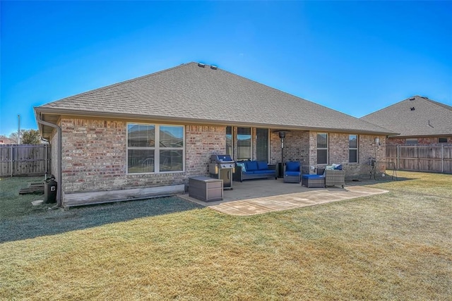 1101 Northridge Blvd, Altus, OK 73521 - back of house with an outdoor living space, a fenced backyard, a patio area, and brick siding