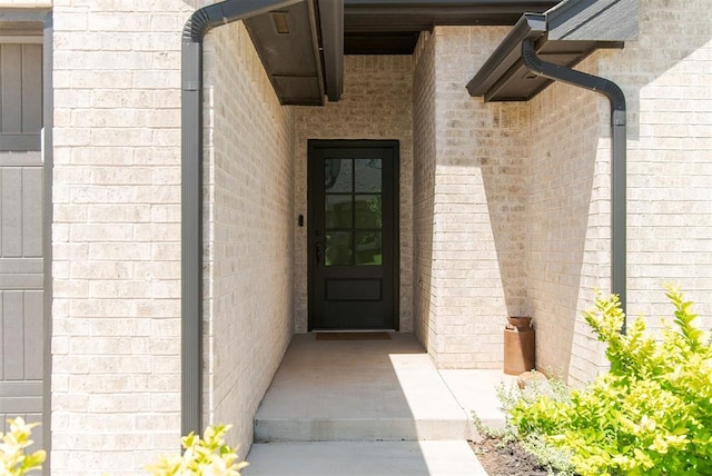 16101 Villa Valeria Way, Edmond, OK 73013 - doorway to property featuring brick siding