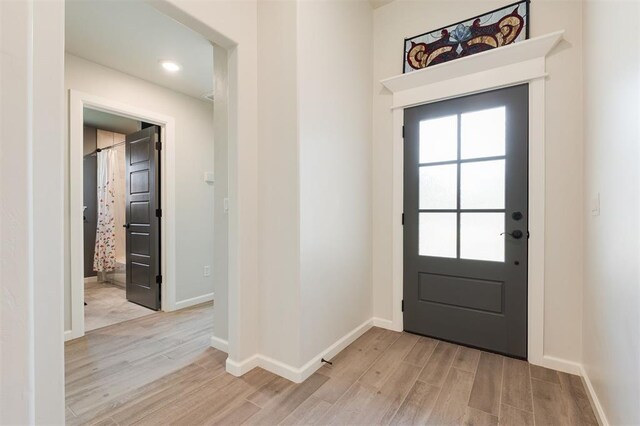 16101 Villa Valeria Way, Edmond, OK 73013 - entryway featuring light wood finished floors and baseboards