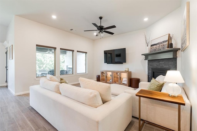16101 Villa Valeria Way, Edmond, OK 73013 - living area featuring ceiling fan, wood finished floors, recessed lighting, and a fireplace
