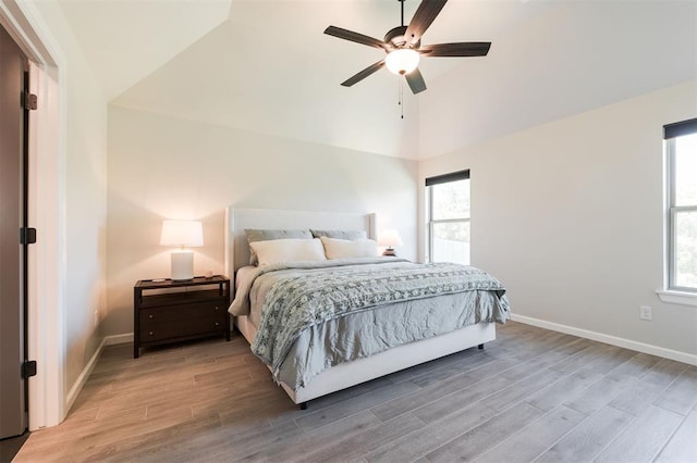 16101 Villa Valeria Way, Edmond, OK 73013 - bedroom featuring wood finished floors, multiple windows, and high vaulted ceiling