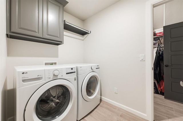 16101 Villa Valeria Way, Edmond, OK 73013 - laundry room featuring cabinet space, separate washer and dryer, and light wood-type flooring