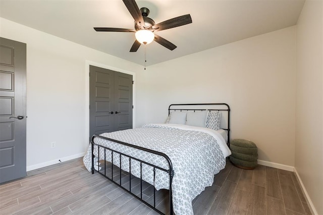 16101 Villa Valeria Way, Edmond, OK 73013 - bedroom featuring light wood-style floors and ceiling fan