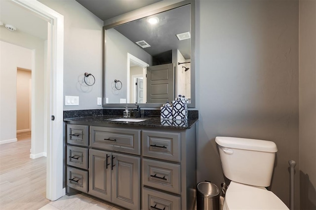 16101 Villa Valeria Way, Edmond, OK 73013 - bathroom featuring vanity and wood finished floors