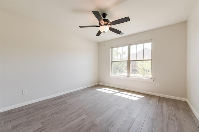16101 Villa Valeria Way, Edmond, OK 73013 - empty room featuring wood finished floors and ceiling fan