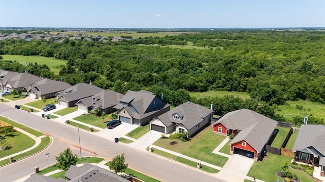 16101 Villa Valeria Way, Edmond, OK 73013 - aerial perspective of suburban area with a forest