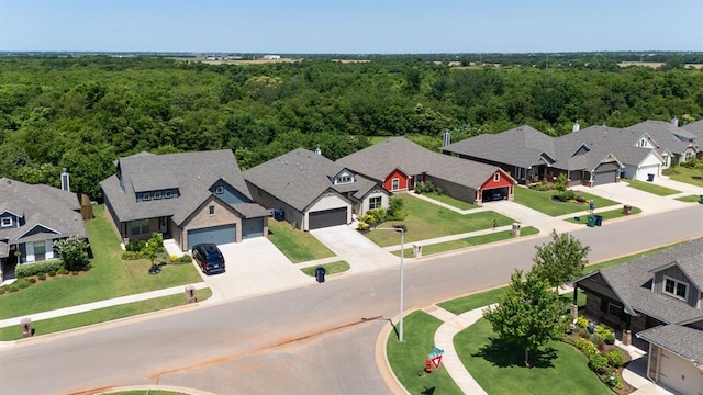 16101 Villa Valeria Way, Edmond, OK 73013 - aerial perspective of suburban area with a heavily wooded area