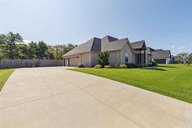 1690 Shaylee Ln, Choctaw, OK 73020 - view of side of property with board and batten siding, concrete driveway, an attached garage, and brick siding