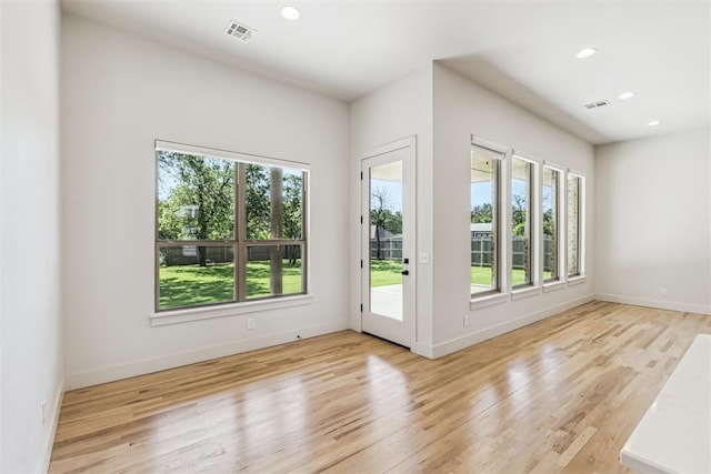 1690 Shaylee Ln, Choctaw, OK 73020 - spare room with plenty of natural light, light wood finished floors, and recessed lighting