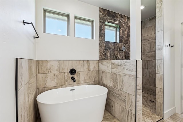 1690 Shaylee Ln, Choctaw, OK 73020 - full bathroom featuring tile walls, a freestanding tub, and walk in shower