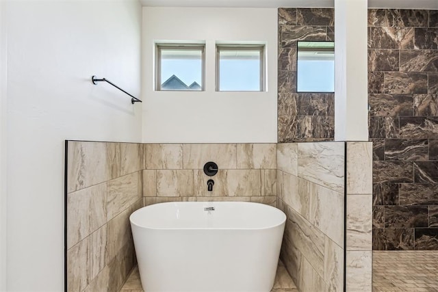 1690 Shaylee Ln, Choctaw, OK 73020 - bathroom featuring tile walls and a soaking tub
