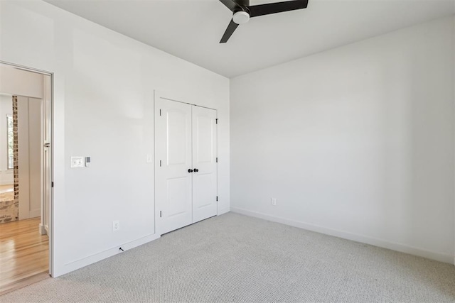 1690 Shaylee Ln, Choctaw, OK 73020 - unfurnished bedroom featuring light carpet, a closet, and ceiling fan