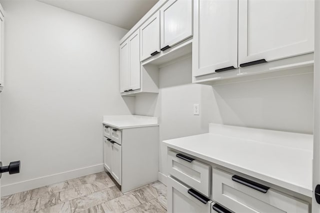 1690 Shaylee Ln, Choctaw, OK 73020 - kitchen with light marble finish floors, light countertops, and white cabinets