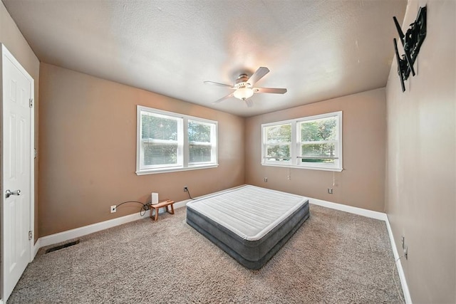 14500 Billy Dr, Edmond, OK 73034 - carpeted bedroom featuring baseboards and ceiling fan