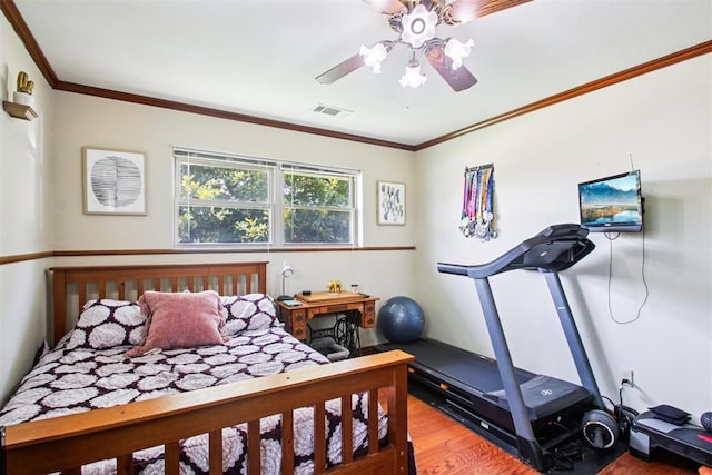 213 Country Club Ter, Oklahoma City, OK 73110 - bedroom with wood finished floors, ornamental molding, and ceiling fan