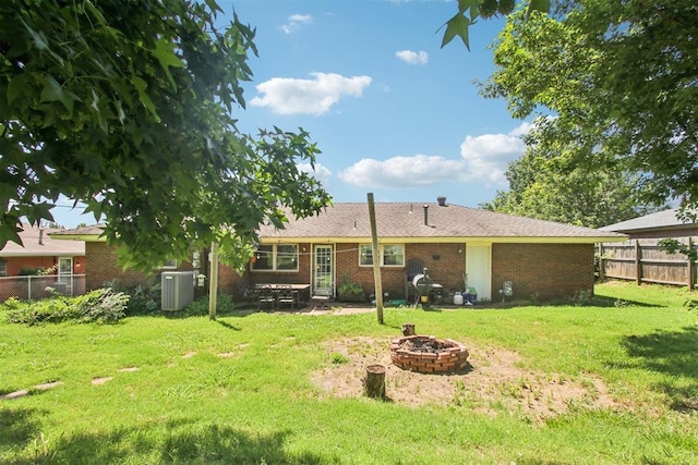 213 Country Club Ter, Oklahoma City, OK 73110 - rear view of property featuring a fire pit and brick siding