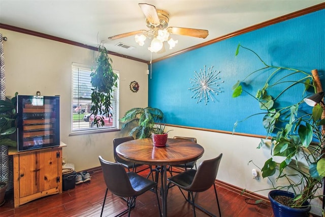 213 Country Club Ter, Oklahoma City, OK 73110 - dining room with a ceiling fan, wood finished floors, and crown molding