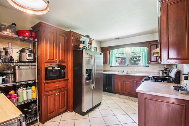 213 Country Club Ter, Oklahoma City, OK 73110 - kitchen featuring black appliances, extractor fan, light countertops, and light tile patterned flooring