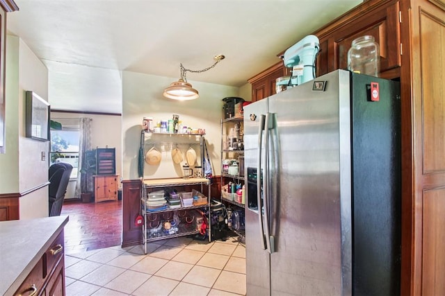213 Country Club Ter, Oklahoma City, OK 73110 - kitchen with stainless steel refrigerator with ice dispenser and light tile patterned floors