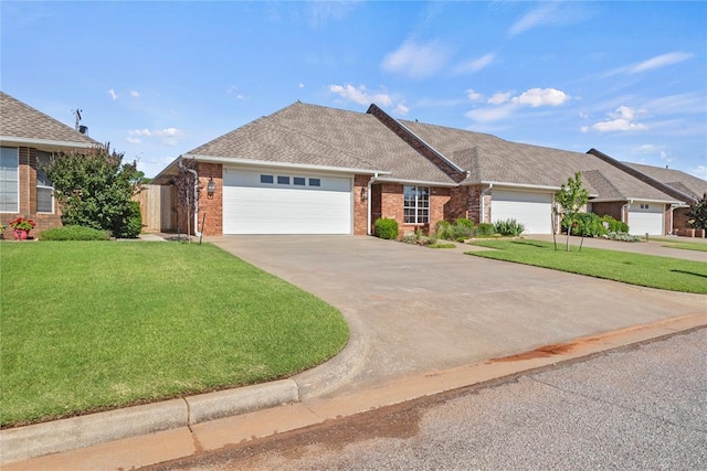901 Gartrell Pl, Weatherford, OK 73096 - ranch-style home with a front lawn, an attached garage, brick siding, and driveway