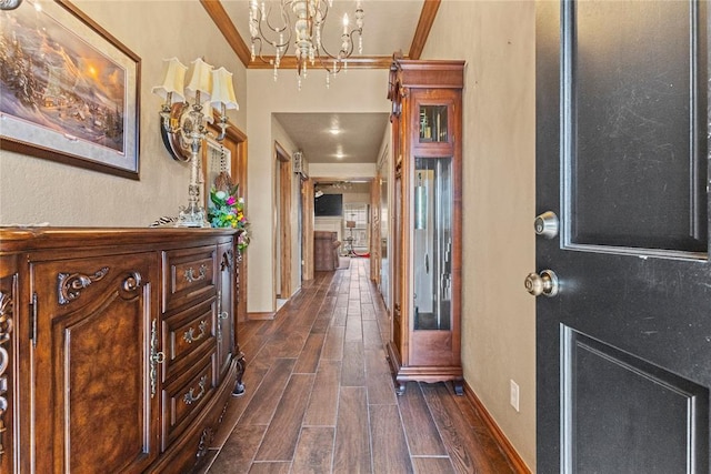 901 Gartrell Pl, Weatherford, OK 73096 - entrance foyer featuring a chandelier, dark wood-style flooring, and ornamental molding