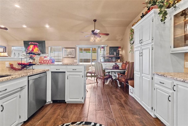 901 Gartrell Pl, Weatherford, OK 73096 - kitchen with dishwasher, white cabinets, dark wood-style floors, ceiling fan, and lofted ceiling