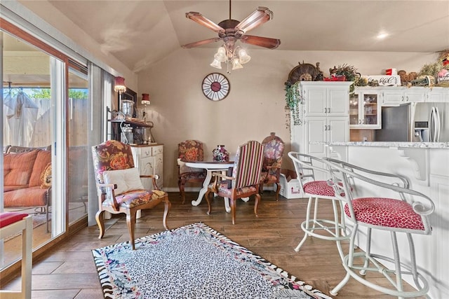901 Gartrell Pl, Weatherford, OK 73096 - dining room with a ceiling fan, vaulted ceiling, and dark wood finished floors
