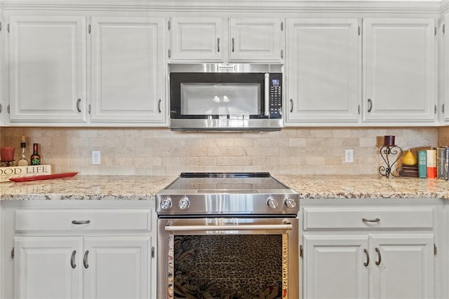 901 Gartrell Pl, Weatherford, OK 73096 - kitchen featuring stainless steel appliances and white cabinetry