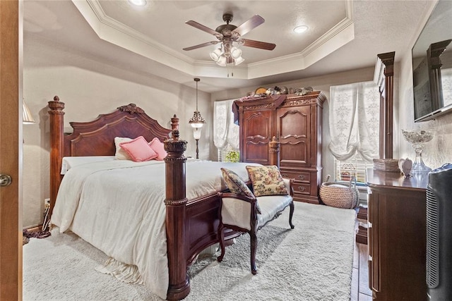 901 Gartrell Pl, Weatherford, OK 73096 - bedroom featuring ornamental molding, a raised ceiling, and a ceiling fan