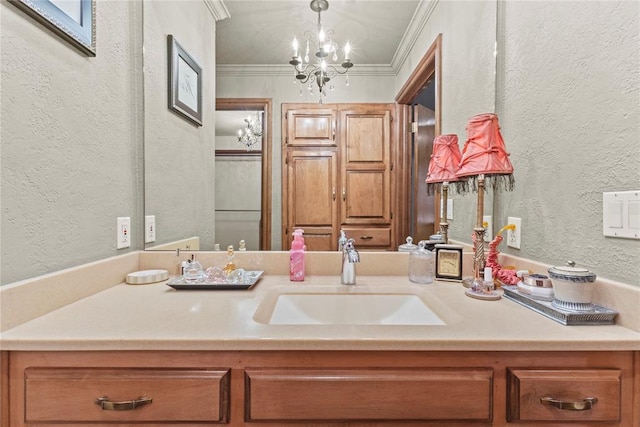 901 Gartrell Pl, Weatherford, OK 73096 - bathroom featuring a textured wall, vanity, a chandelier, and crown molding