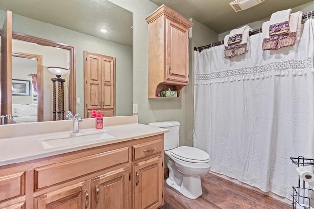 901 Gartrell Pl, Weatherford, OK 73096 - full bathroom featuring wood finished floors, vanity, recessed lighting, and curtained shower