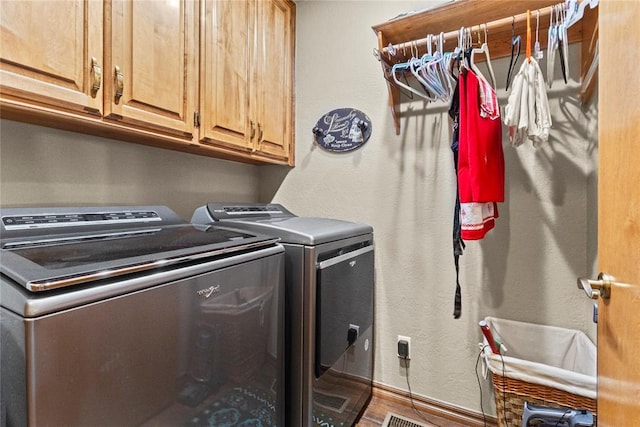 901 Gartrell Pl, Weatherford, OK 73096 - washroom featuring independent washer and dryer and cabinet space