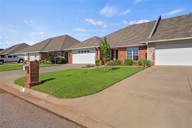 901 Gartrell Pl, Weatherford, OK 73096 - view of front of home with concrete driveway, brick siding, a front yard, an attached garage, and a shingled roof