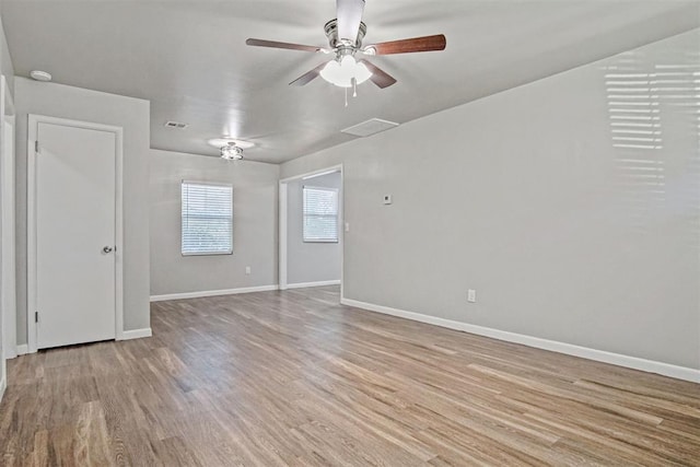 909 Buck Dr, Shawnee, OK 74801 - empty room featuring wood finished floors and a ceiling fan