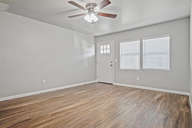 909 Buck Dr, Shawnee, OK 74801 - foyer featuring a ceiling fan and wood finished floors