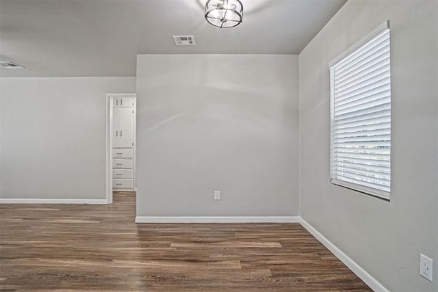 909 Buck Dr, Shawnee, OK 74801 - unfurnished room with wood finished floors and plenty of natural light