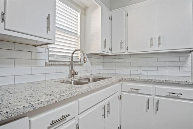 909 Buck Dr, Shawnee, OK 74801 - kitchen featuring white cabinets, decorative backsplash, and light stone counters
